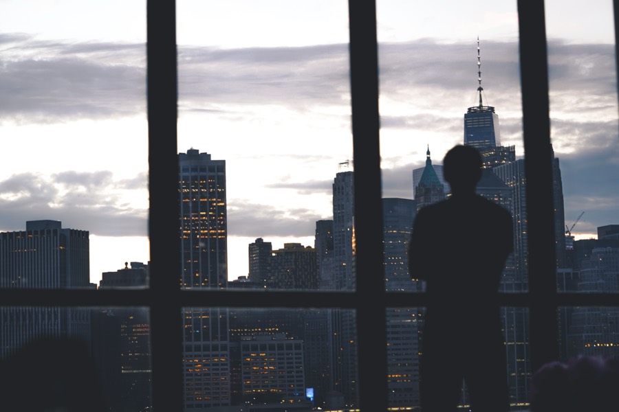 Silhouette of a businessman at a high-rise window