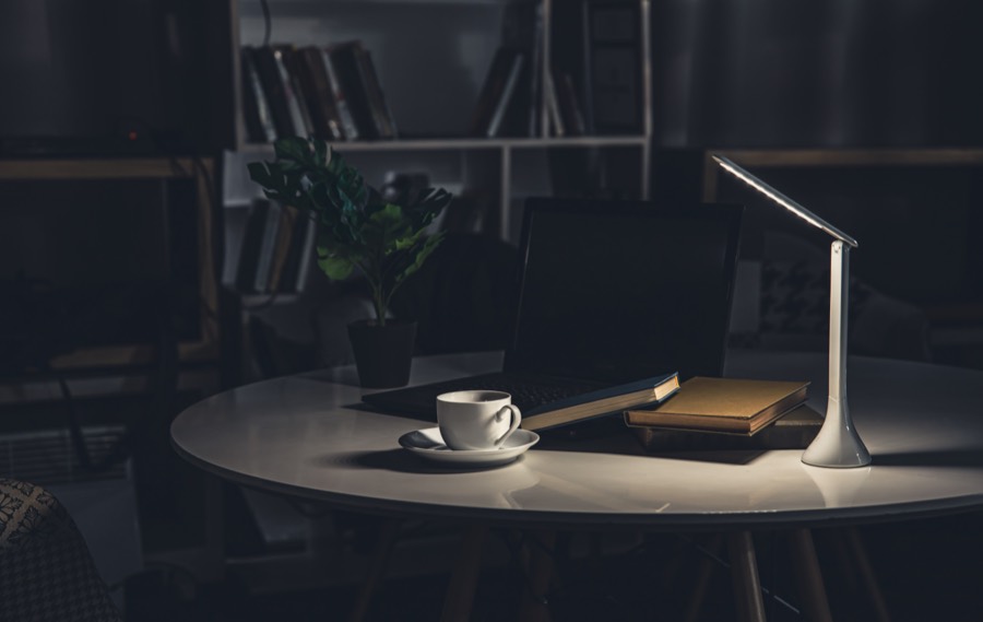 Late-night workspace with a lamp and laptop